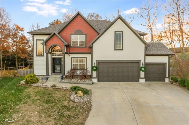 view of front of home with a front lawn and a garage