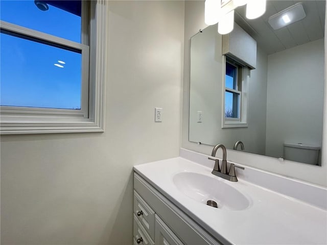 bathroom with vanity and toilet