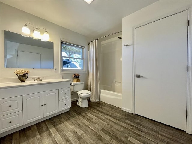 full bathroom with shower / bath combo, toilet, wood-type flooring, and vanity