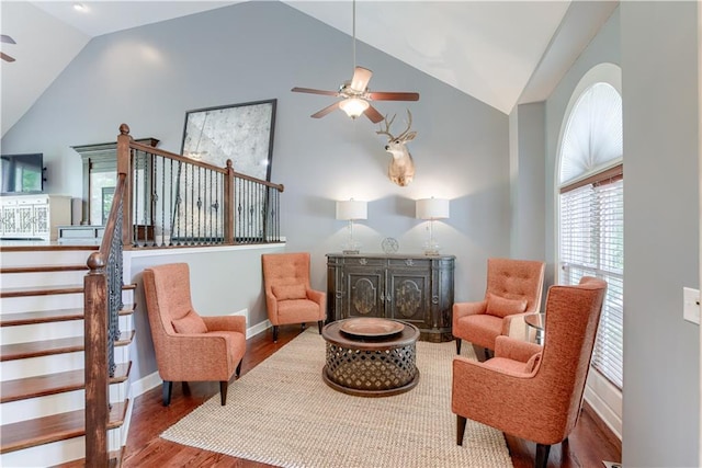 6764 Longview Rd, Shawnee, KS 66218 - living area featuring lofted ceiling, ceiling fan, wood finished floors, and healthy amount of natural light