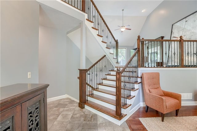 6764 Longview Rd, Shawnee, KS 66218 - stairway with a ceiling fan, baseboards, and high vaulted ceiling
