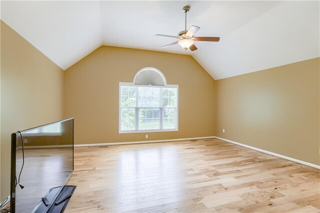 6764 Longview Rd, Shawnee, KS 66218 - spare room featuring ceiling fan, light wood-type flooring, lofted ceiling, and baseboards