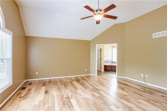 6764 Longview Rd, Shawnee, KS 66218 - spare room with ceiling fan, light wood finished floors, baseboards, and high vaulted ceiling