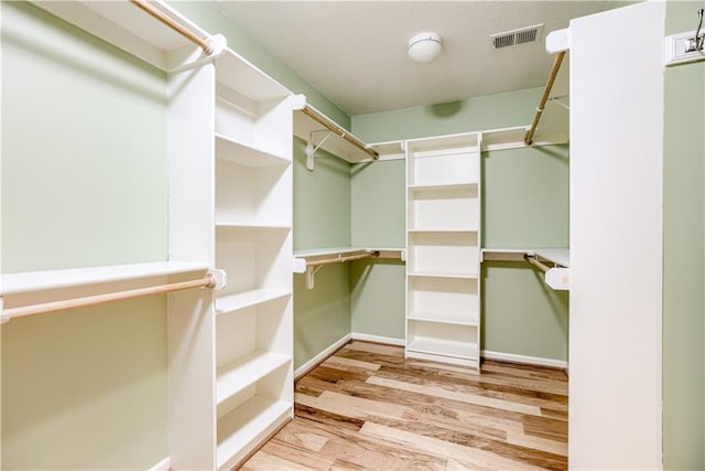 6764 Longview Rd, Shawnee, KS 66218 - walk in closet with wood finished floors