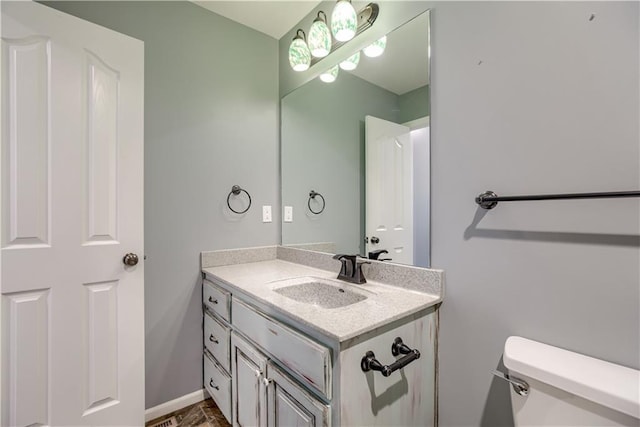 6764 Longview Rd, Shawnee, KS 66218 - bathroom with vanity, toilet, and baseboards