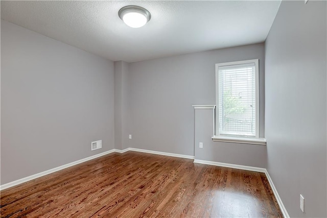6764 Longview Rd, Shawnee, KS 66218 - unfurnished room with wood finished floors and baseboards