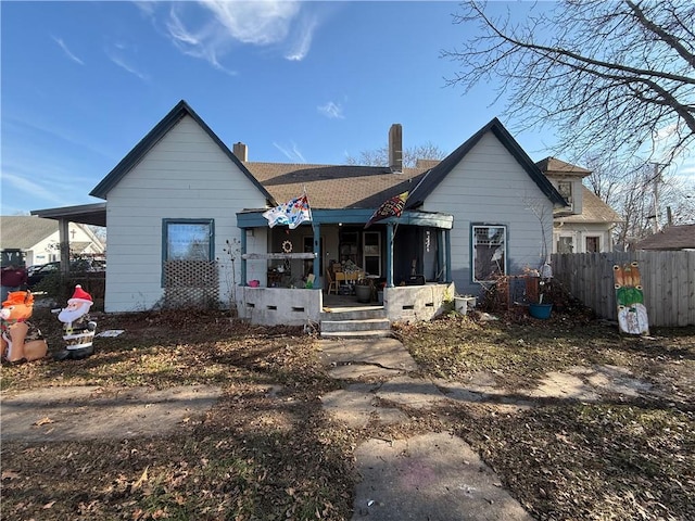 back of property featuring a porch