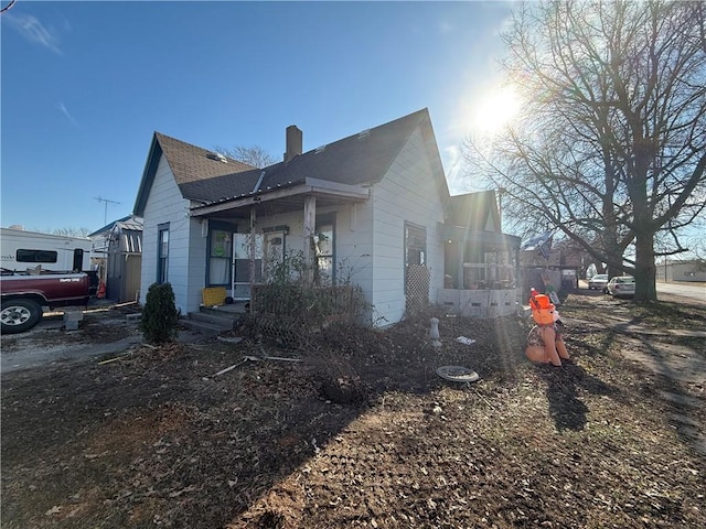 view of property exterior with a porch