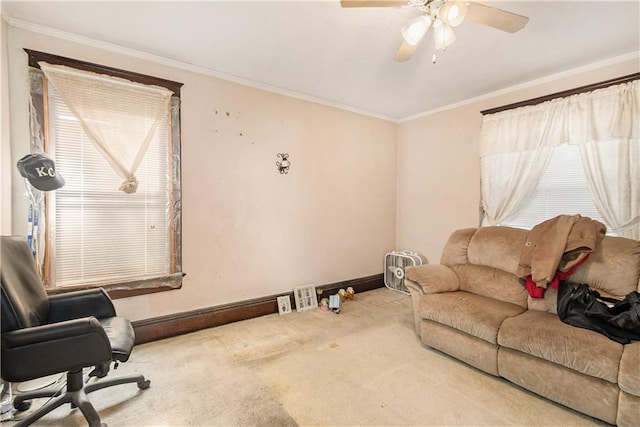 living room featuring carpet, ceiling fan, and crown molding