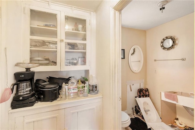 bar with white cabinetry