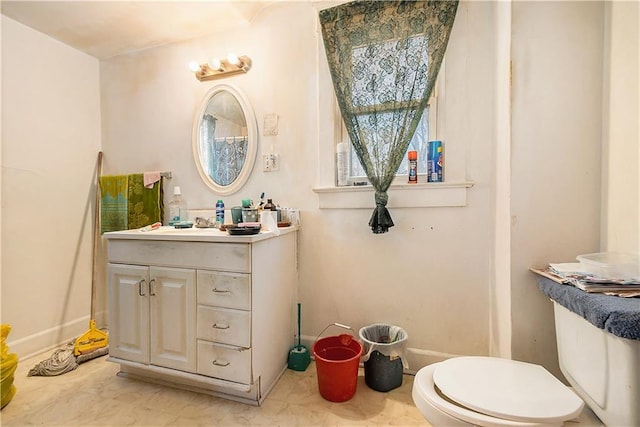 bathroom with vanity and toilet