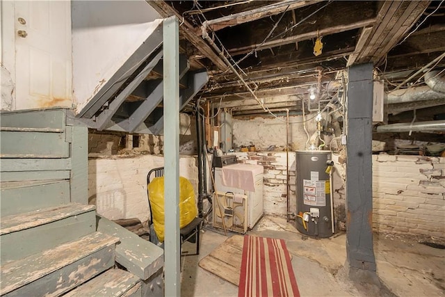 basement featuring washer / clothes dryer and gas water heater