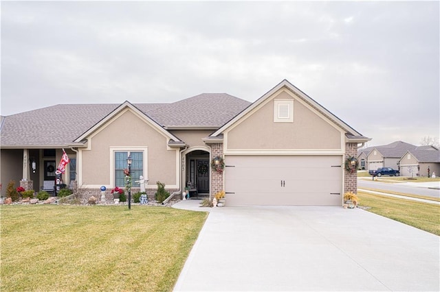 single story home with a garage and a front lawn