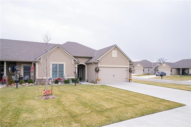 ranch-style house featuring a front yard and a garage