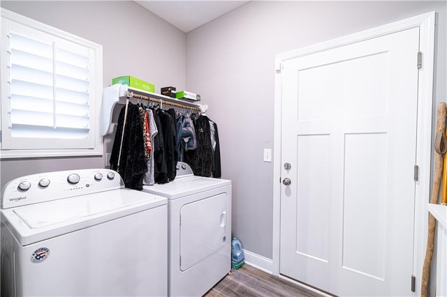 washroom with washing machine and dryer and wood-type flooring