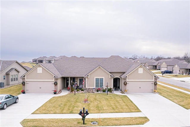 single story home featuring a front yard, a garage, and central AC unit