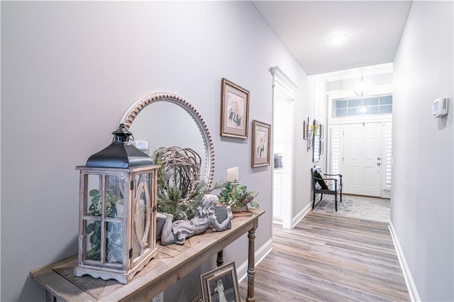 hallway with light wood-type flooring