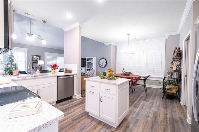 kitchen with stainless steel dishwasher, wood-type flooring, decorative light fixtures, white cabinets, and ceiling fan with notable chandelier