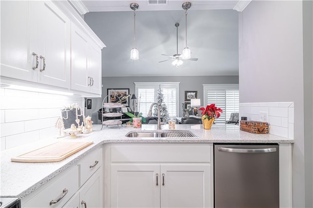 kitchen with stainless steel dishwasher, ceiling fan, sink, pendant lighting, and white cabinetry