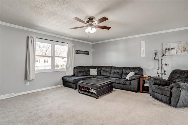 carpeted living area featuring ornamental molding, ceiling fan, a textured ceiling, and baseboards