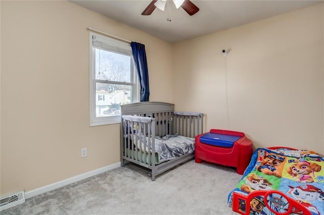 bedroom with light carpet, baseboards, visible vents, and ceiling fan