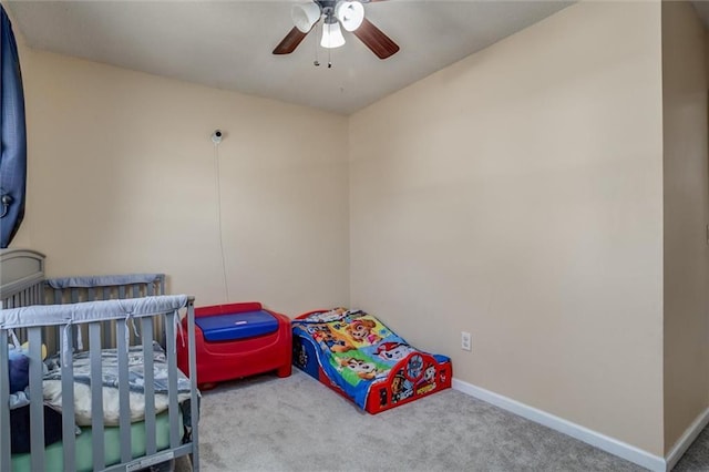 bedroom featuring a ceiling fan, carpet flooring, and baseboards