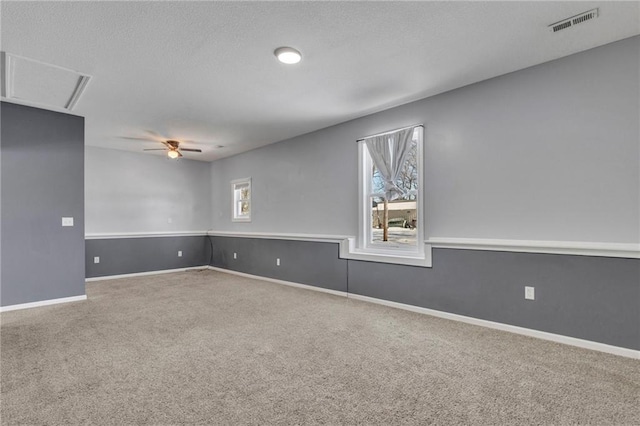 empty room with carpet floors and ceiling fan