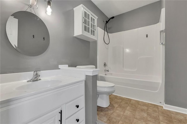 full bathroom with bathtub / shower combination, vanity, and toilet