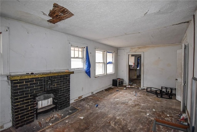 unfurnished living room featuring a textured ceiling