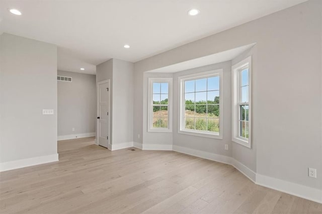 unfurnished room featuring light wood-type flooring