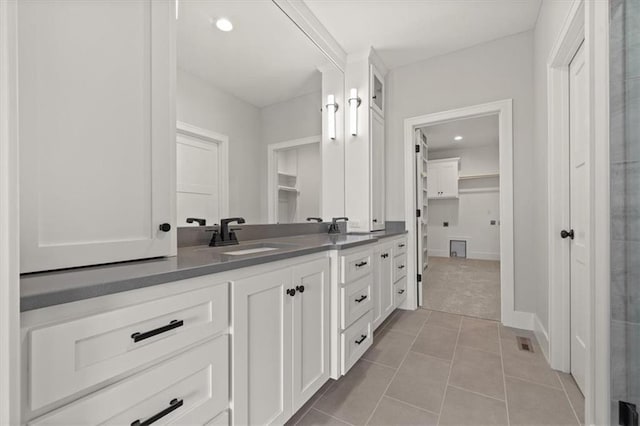 bathroom with vanity and tile patterned floors