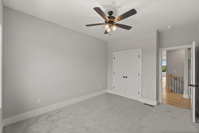4027 NE Sagamore Dr Unit A, Lees Summit, MO 64064 - unfurnished bedroom with carpet floors, a closet, and a ceiling fan