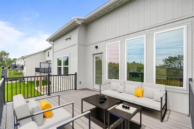 deck with a lawn and an outdoor living space