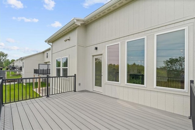 wooden terrace with a yard