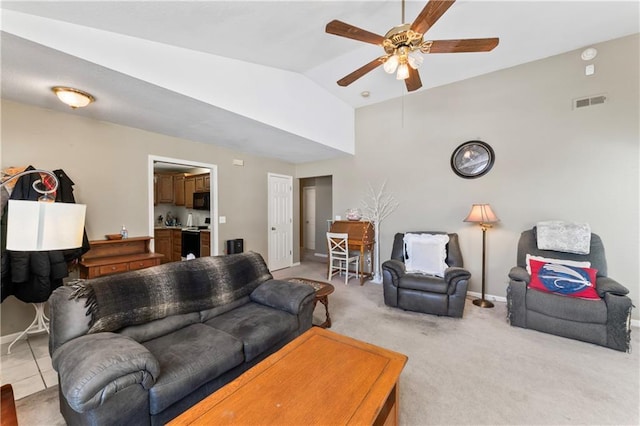 living room with carpet flooring, ceiling fan, and vaulted ceiling