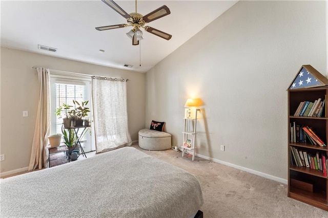 bedroom with ceiling fan, light colored carpet, and vaulted ceiling