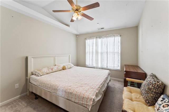 carpeted bedroom featuring ceiling fan and vaulted ceiling