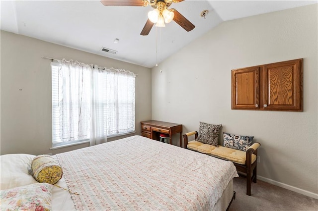 carpeted bedroom with multiple windows, ceiling fan, and lofted ceiling