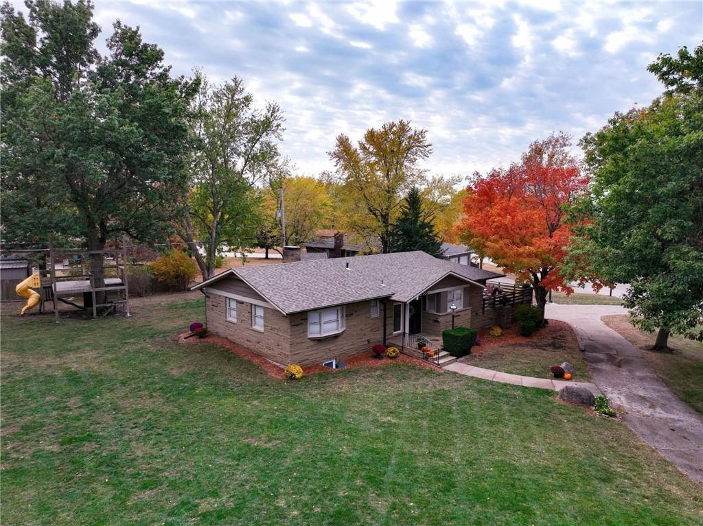 exterior space with a front yard and a playground