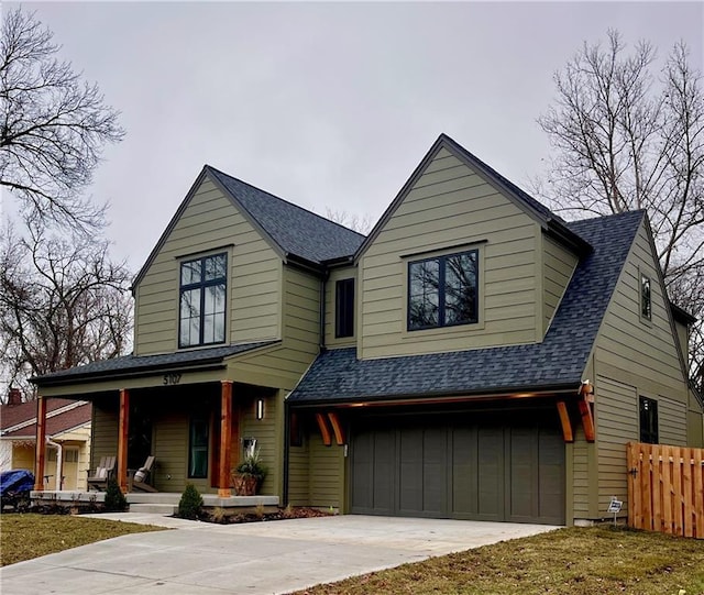 view of front of property featuring a porch and a garage