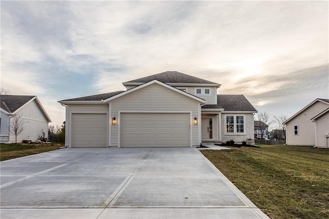 view of front property featuring a garage and a front lawn