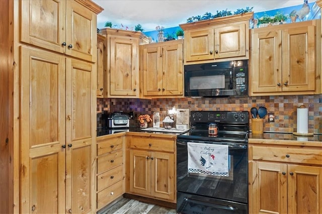 kitchen featuring tasteful backsplash, black appliances, and light brown cabinets