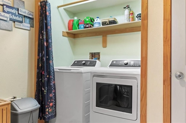 laundry room with separate washer and dryer