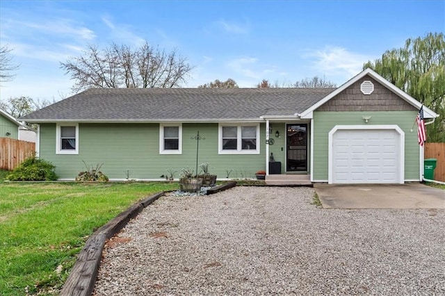 ranch-style home with a garage and a front lawn