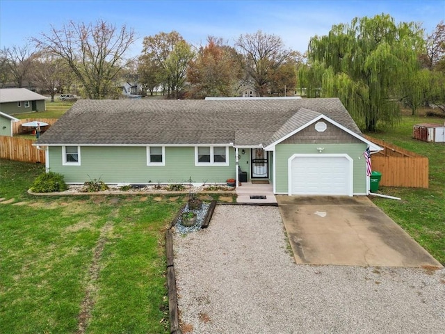 ranch-style home with a garage and a front lawn