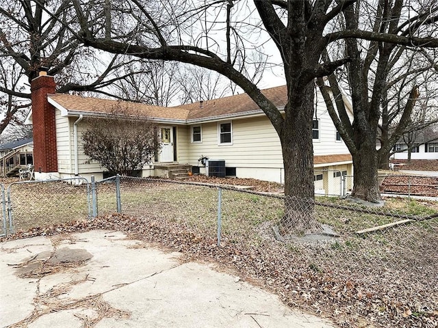 back of property with central air condition unit