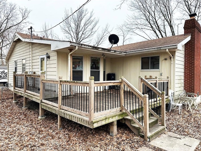 back of property with a deck