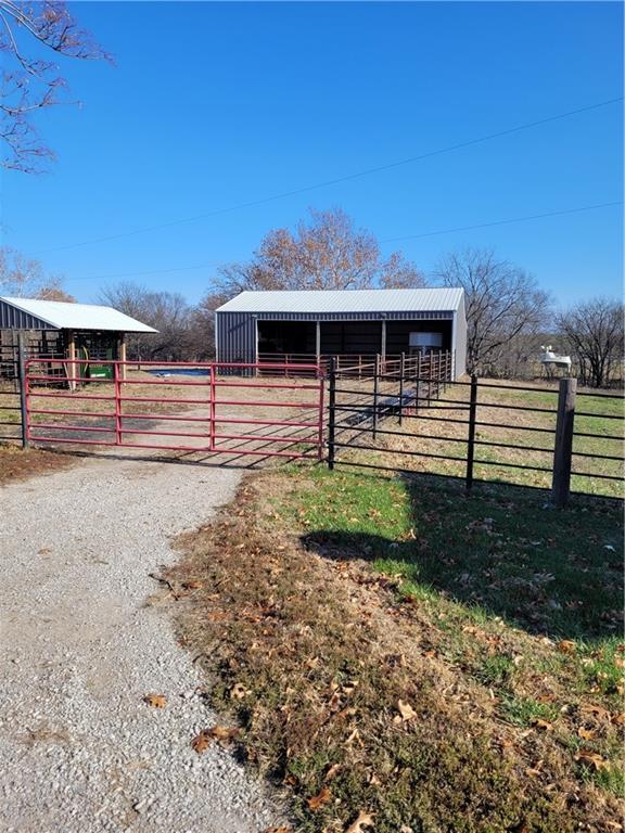 view of stable with a rural view