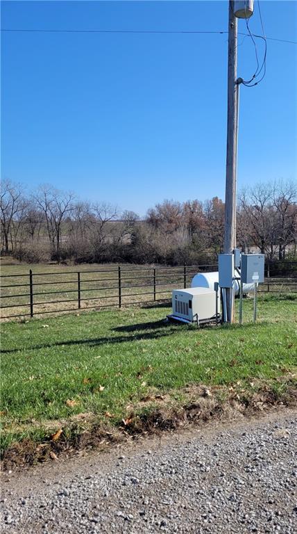 view of yard with a rural view