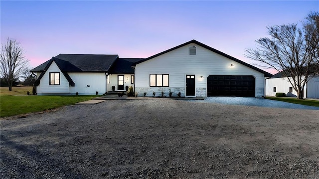 single story home featuring a garage